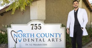 Dr. AJ Marabeh Next to the North Country dental office sign