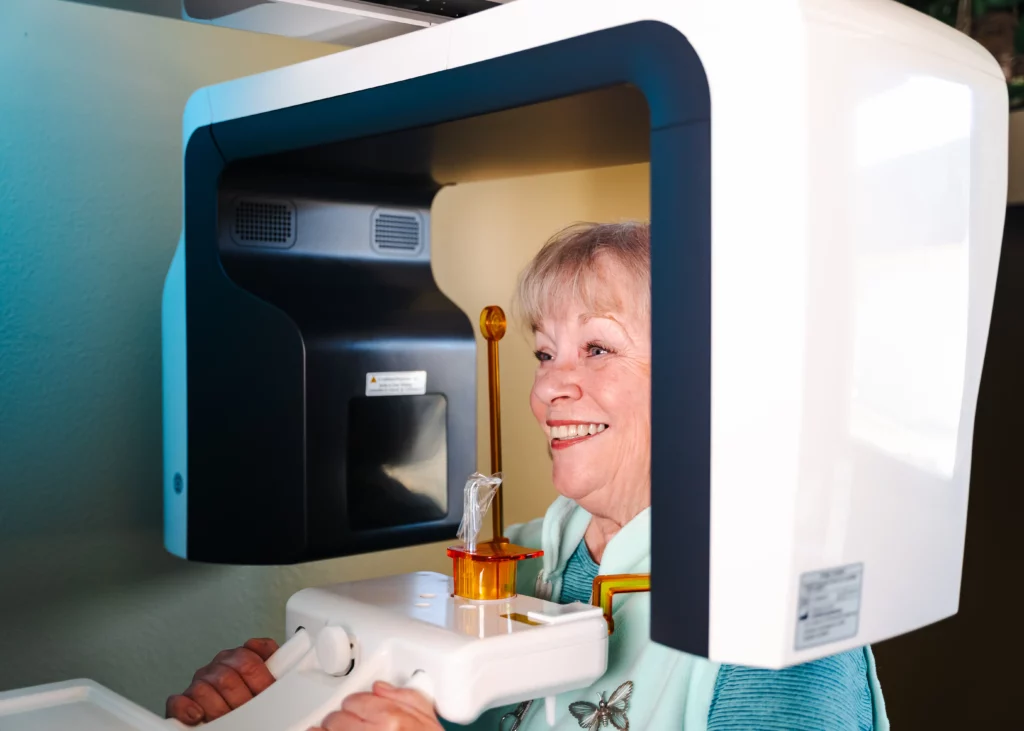 Patient seated in a CBCT 3D imaging scanner