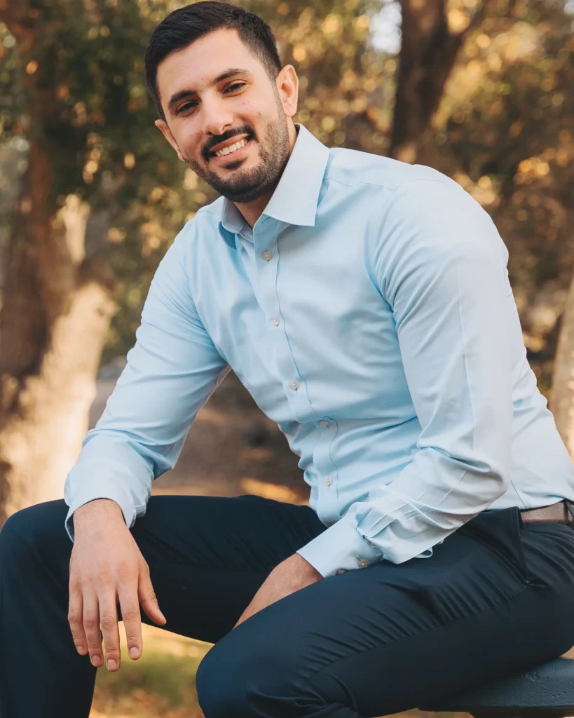Dr. AJ Marabeh seated outdoors