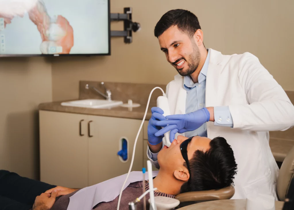 Dr. Marabeh taking a digital intraoral scan of a patient